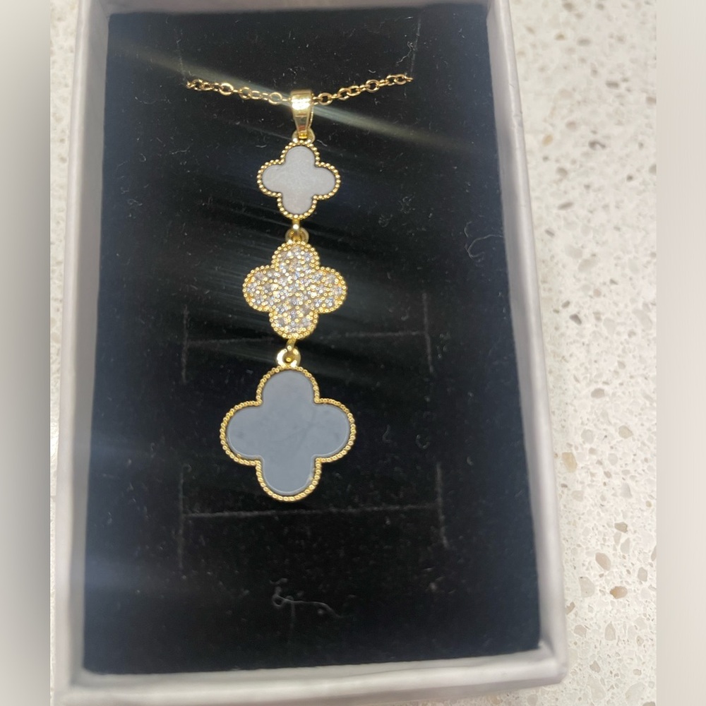 Clover pendant gold over sliver necklace